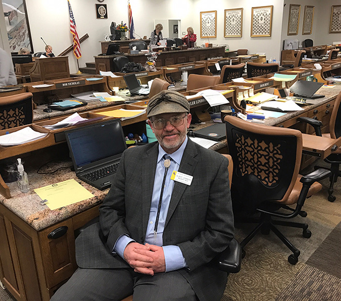 Albert Sommers at his desk in the Legislature